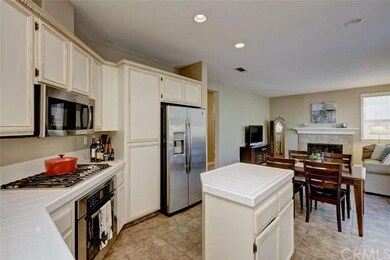 A light and bright kitchen overlooks the yard and 