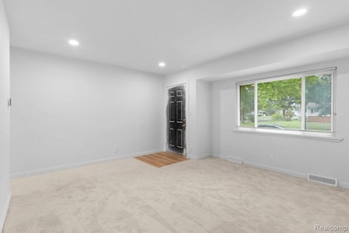 Unfurnished bedroom featuring recessed lighting and light colored carpet