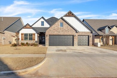 View of front of property with a garage and centra