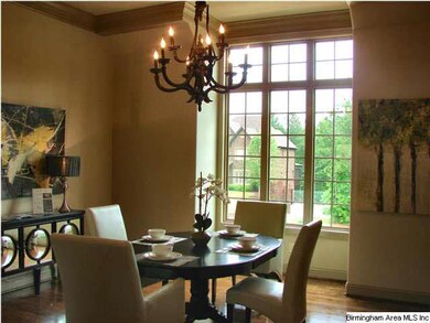 Large separate dining room on the front of the home is off the kitchen and has hardwood floors, crown moulding.