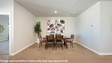 Dining space featuring light wood-style flooring and recessed lighting