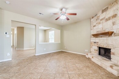 Unfurnished living room featuring light tile patt