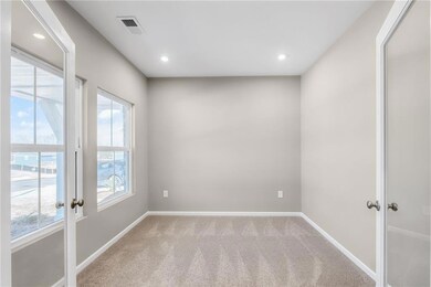 Unfurnished room with baseboards, french doors, vi