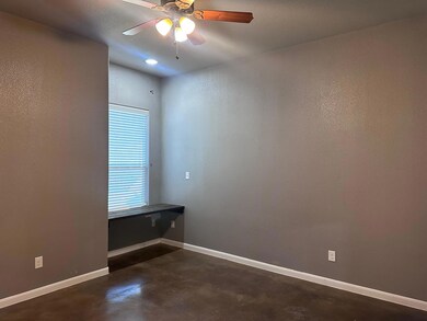 Empty room featuring concrete flooring, ceiling f
