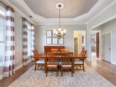 Dining space with a notable chandelier, wood-type 