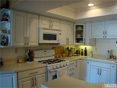 Newer white appliances include gas range and micro