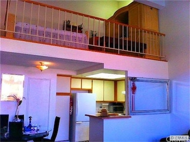 View of open living area and loft from entry