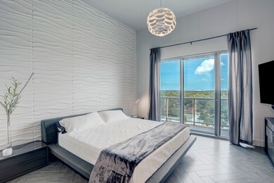 Primary Bedroom features decorative wall, mounted