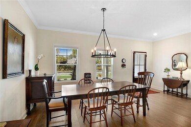 Another view of the dining room and entry.