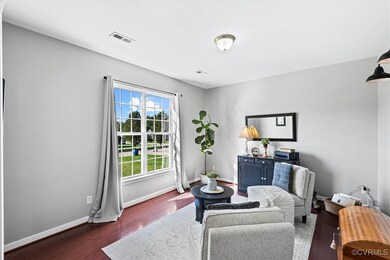 To the left of entryway