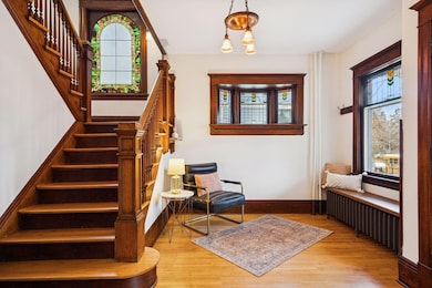 Front sitting room with original, beautiful stained glass windows