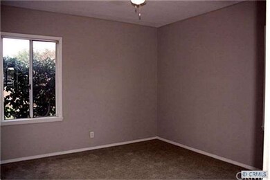 Spacious master bedroom with new carpet