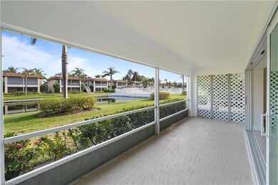 Unfurnished sunroom featuring a water view and a residential view
