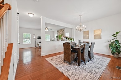 Dining space with hardwood / wood-style floors, ce