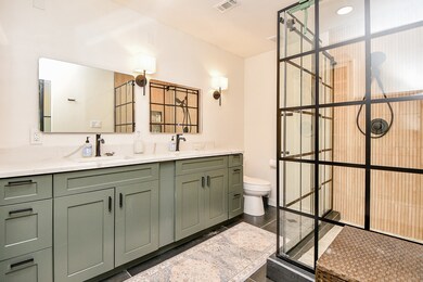This bathroom features a modern, spacious design w