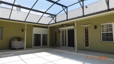 Over sized screen enclosed & covered lanai (plumbed for a pool) with automatic hurricane shutters and access to a garden/pool bath.