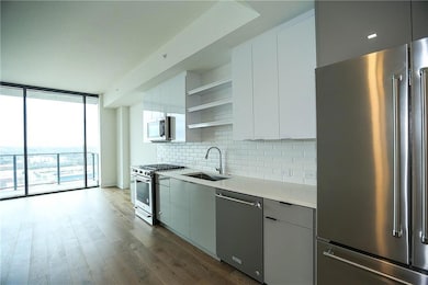 Kitchen featuring floor to ceiling windows, high q