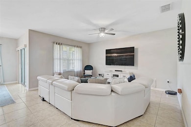 The open living room offers a bright, inviting space, perfect for entertaining and everyday comfort.