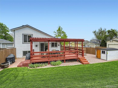 Large backyard with covered deck