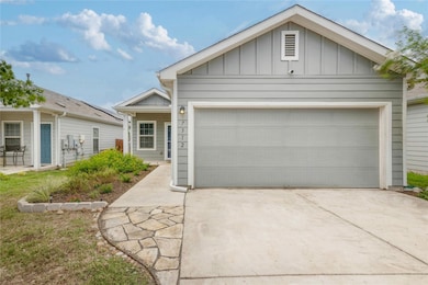 View of front of property featuring concrete driv
