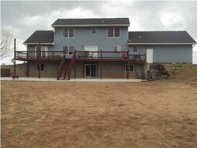Back of home featuring 50' deck and walkout baseme