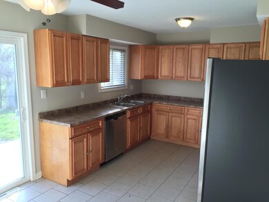 Kitchen features maple cabinetry