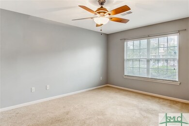 Large 15'10 X 11'10 Living room with ceiling fan a
