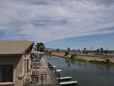 Dock featuring a water view and a balcony