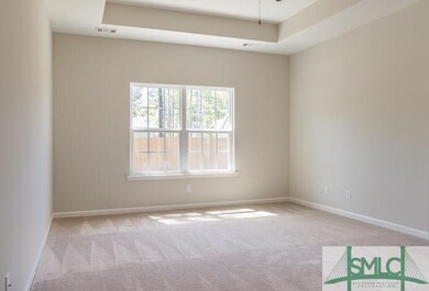Intimate owner's suite with stunning tray ceiling.