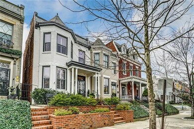 Notice new two level brick planters spanning the front and new handrails