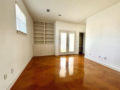 Additional shelving as storage space by the private entrance.