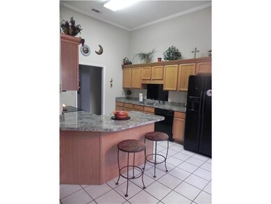 Another view of kitchen with breakfast bar for cas