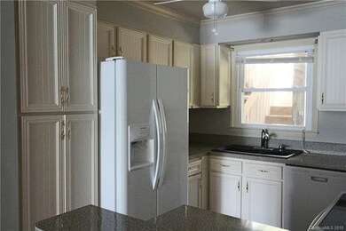 Newer kitchen cabinets and appliance.