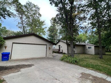 Detached 2 car garage with large concrete apron