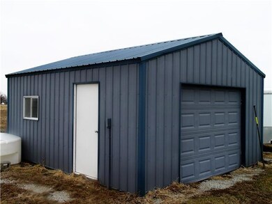 Metal outbuilding with electrical, walk-out and ga