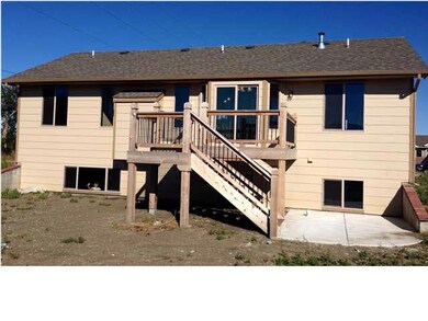 Back of home featuring a composite and cedar deck.