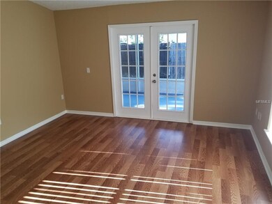 Dining area with French doors to screened-in, cove