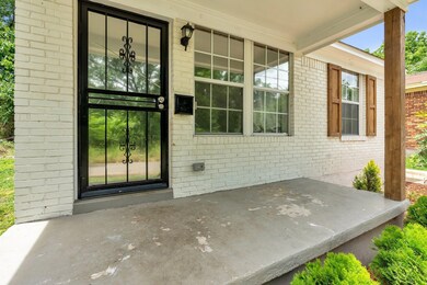 View of entry with covered porch