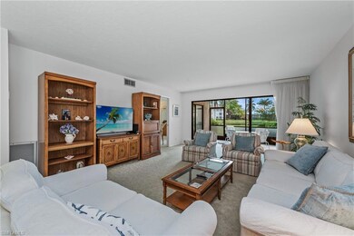 Living area featuring light carpet