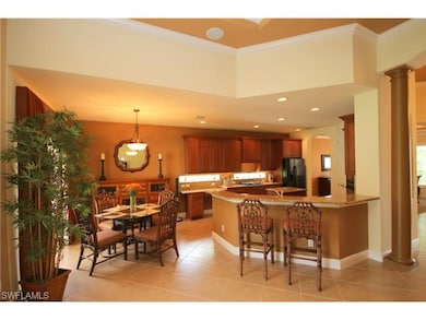 Kitchen, informal breakfast bar, and eating area from great room