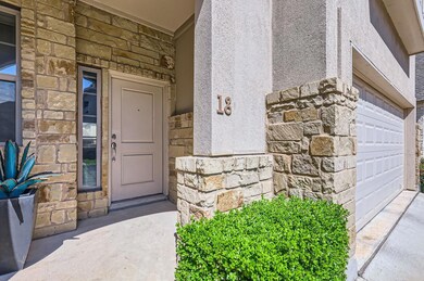 Entrance to property featuring stone siding