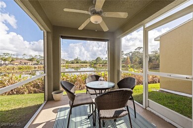 Sunroom featuring a water view and a ceiling fan