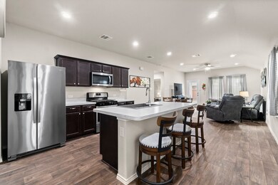 A perfect spot for gatherings! This kitchen is open to the living and dining areas.