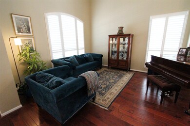The formal living room is to the left of the entry hall, and can easily accommodate a grand piano.