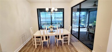 Dining area with wood-type flooring and ceiling fa