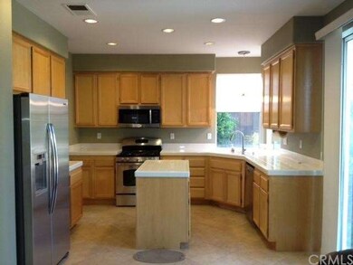 Clean, crisp kitchen with stainless steel applianc