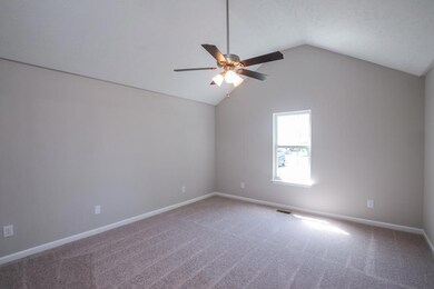 Master bedroom has vaulted ceiling. New carpet.