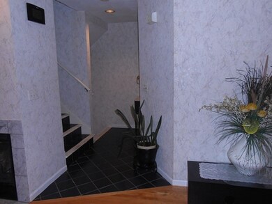 Hallway leading to upstairs and/or lower level.