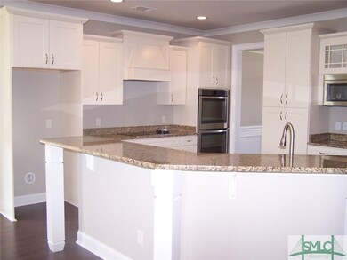 Beautiful cabinetry with granite countertops overl
