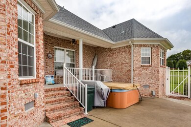 Covered back porch and patio with hot tub included!!!